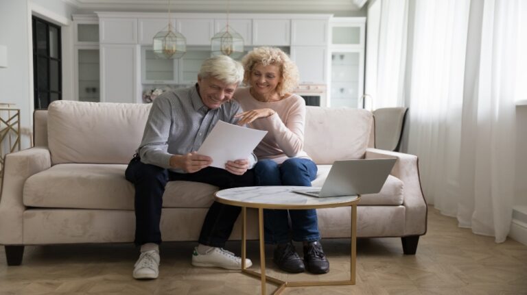 older couple with document