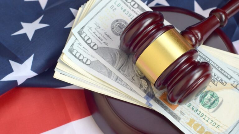 Gavel with money and American flag