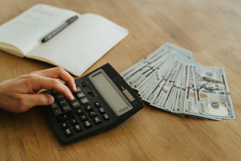 calculator and money on table