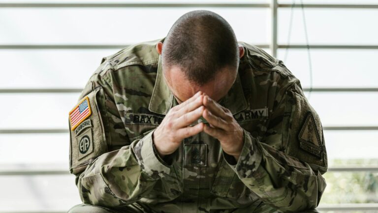 veteran worried hands on head