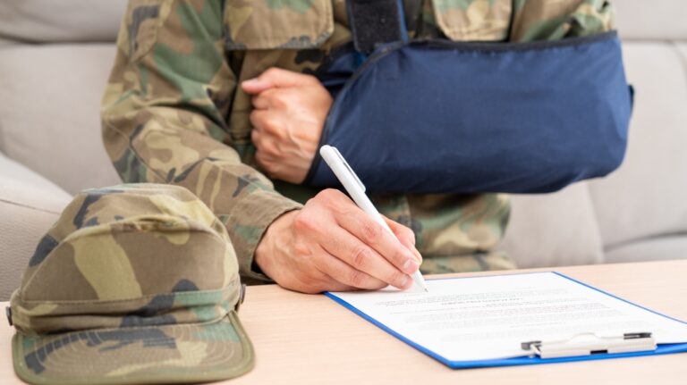 lawyer helps a military man fill out an application